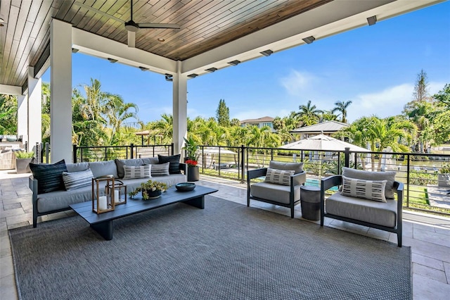 view of patio / terrace featuring ceiling fan, an outdoor hangout area, and a balcony
