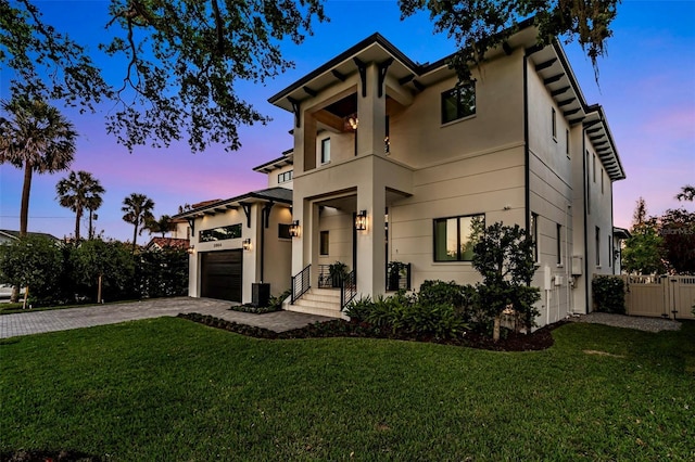 5004 S The Riviera, Tampa, FL 33609 - mediterranean / spanish-style home with decorative driveway, stucco siding, and a garage