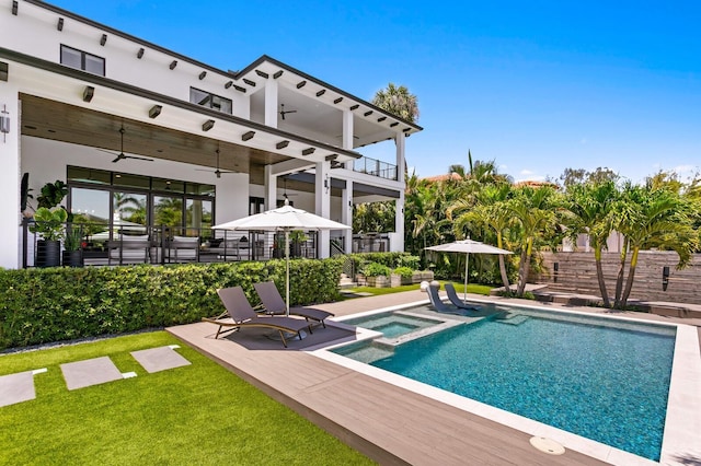 5004 S The Riviera, Tampa, FL 33609 - view of pool with a ceiling fan, a pool with connected hot tub, a patio area, and a lawn