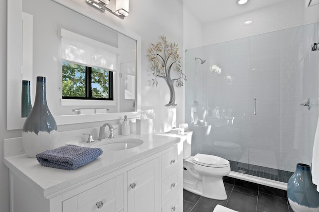 5004 S The Riviera, Tampa, FL 33609 - bathroom featuring toilet, vanity, a shower stall, and tile patterned floors