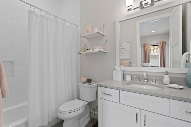 5004 S The Riviera, Tampa, FL 33609 - full bath featuring vanity, toilet, and shower / bath combo with shower curtain