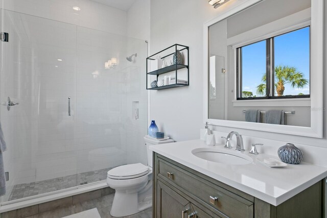 5004 S The Riviera, Tampa, FL 33609 - bathroom featuring vanity, a shower stall, and toilet