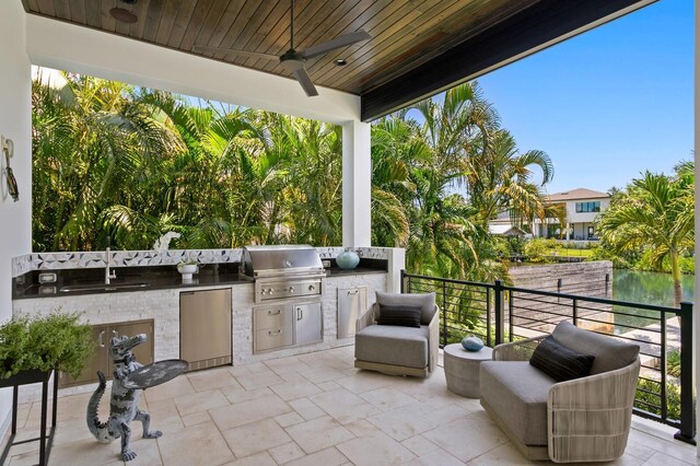 5004 S The Riviera, Tampa, FL 33609 - view of patio featuring a ceiling fan