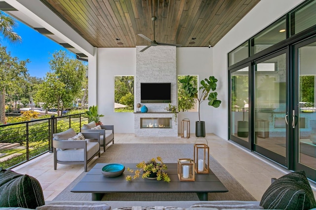 5004 S The Riviera, Tampa, FL 33609 - view of patio with an outdoor living space with a fireplace