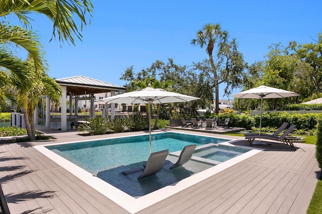 5004 S The Riviera, Tampa, FL 33609 - view of pool featuring a gazebo, a pool with connected hot tub, and a wooden deck
