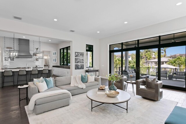 5004 S The Riviera, Tampa, FL 33609 - living room featuring wood finished floors, plenty of natural light, recessed lighting, and a chandelier