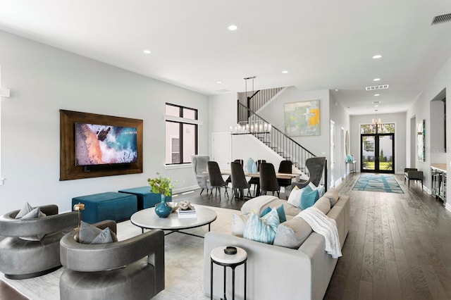 5004 S The Riviera, Tampa, FL 33609 - living room with hardwood / wood-style flooring, recessed lighting, stairway, baseboards, and a chandelier