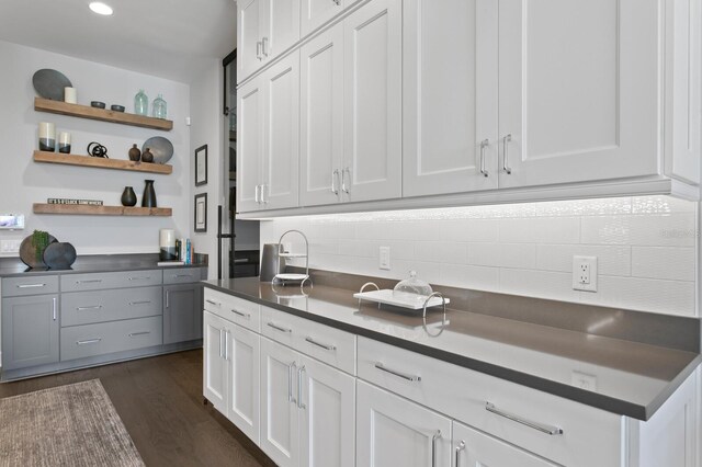 5004 S The Riviera, Tampa, FL 33609 - kitchen featuring tasteful backsplash, open shelves, dark countertops, white cabinets, and recessed lighting