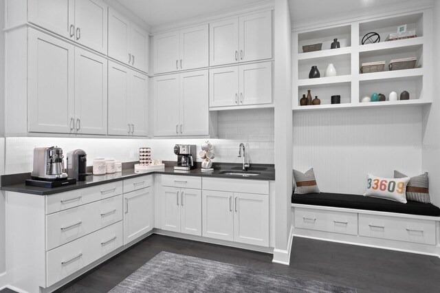 5004 S The Riviera, Tampa, FL 33609 - kitchen with a sink, open shelves, dark countertops, backsplash, and white cabinets