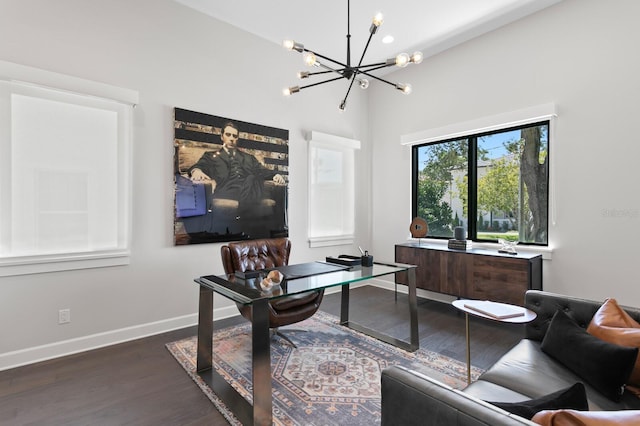 5004 S The Riviera, Tampa, FL 33609 - home office with a chandelier, dark wood finished floors, and baseboards