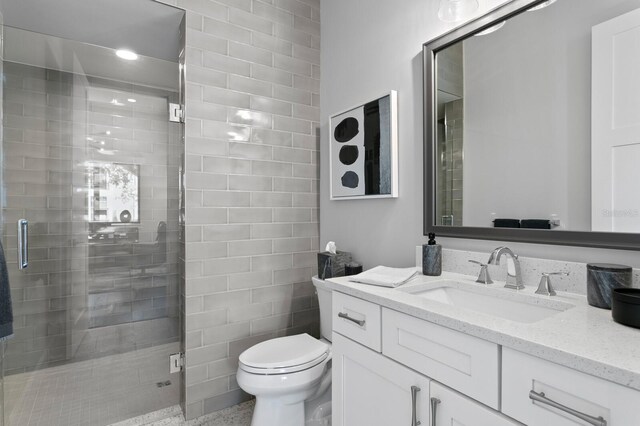 5004 S The Riviera, Tampa, FL 33609 - full bath with vanity, a stall shower, and toilet