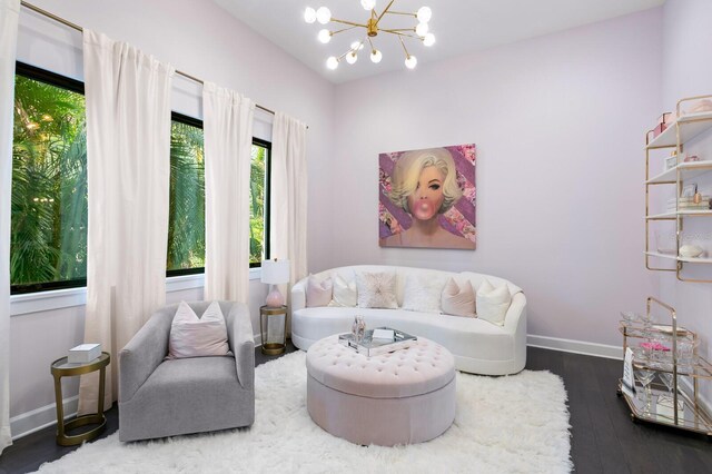 5004 S The Riviera, Tampa, FL 33609 - living area with baseboards, dark wood-style floors, and a chandelier