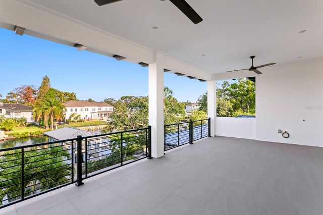 5004 S The Riviera, Tampa, FL 33609 - view of patio with ceiling fan, a balcony, and a residential view