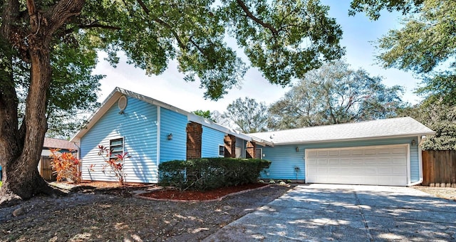 ranch-style house featuring a garage