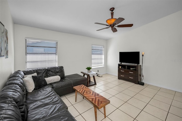 tiled living room with ceiling fan