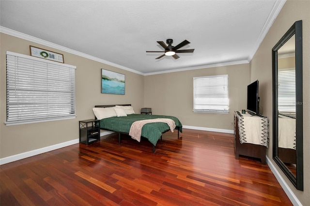 bedroom featuring crown molding, dark wood-type flooring, and ceiling fan