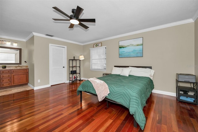 bedroom with ensuite bath, ornamental molding, dark hardwood / wood-style floors, a closet, and ceiling fan