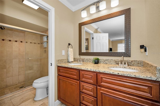 bathroom with tile patterned flooring, vanity, ornamental molding, toilet, and walk in shower