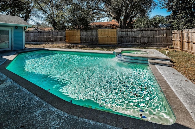 view of swimming pool with an in ground hot tub