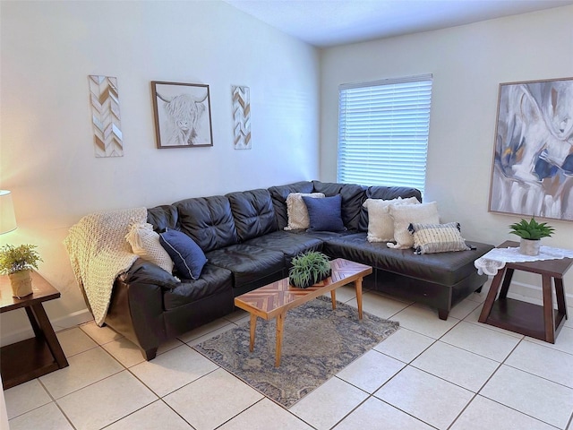 living area with light tile patterned flooring and baseboards