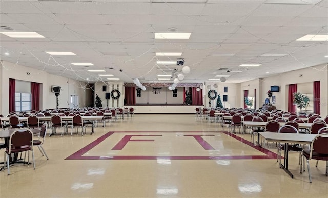 interior space featuring a drop ceiling