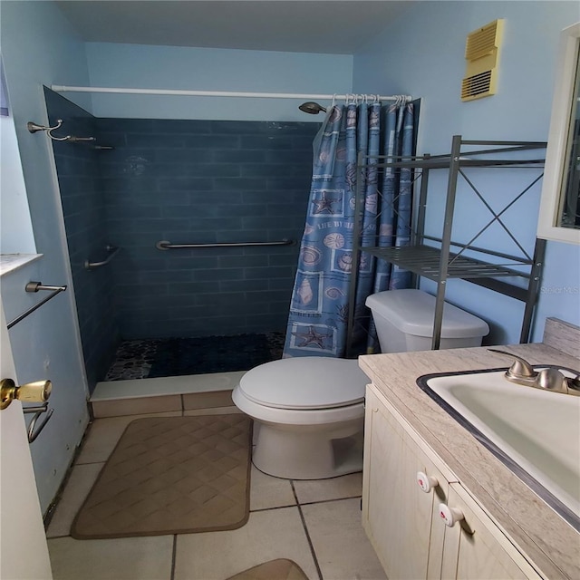 full bath featuring vanity, tiled shower, tile patterned flooring, and toilet