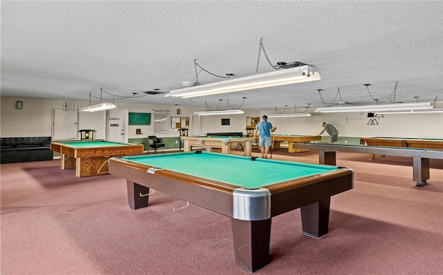 rec room with carpet floors, billiards, and a textured ceiling