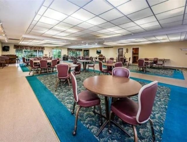 dining space featuring a paneled ceiling