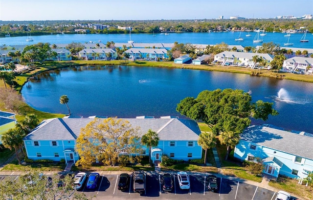 bird's eye view featuring a water view and a residential view