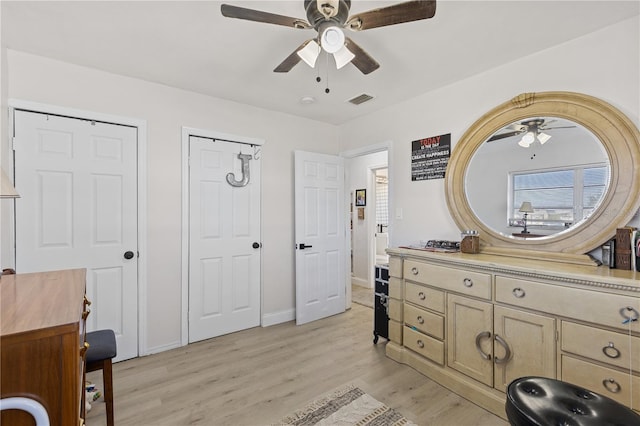 bathroom with vanity, hardwood / wood-style floors, and ceiling fan