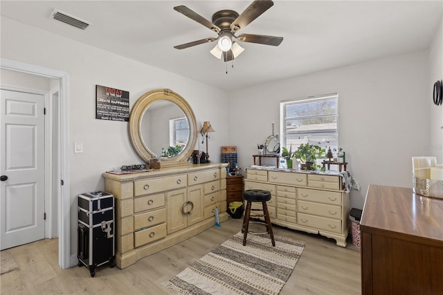 sitting room featuring light hardwood / wood-style floors and ceiling fan