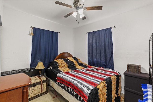 bedroom featuring ceiling fan and light colored carpet