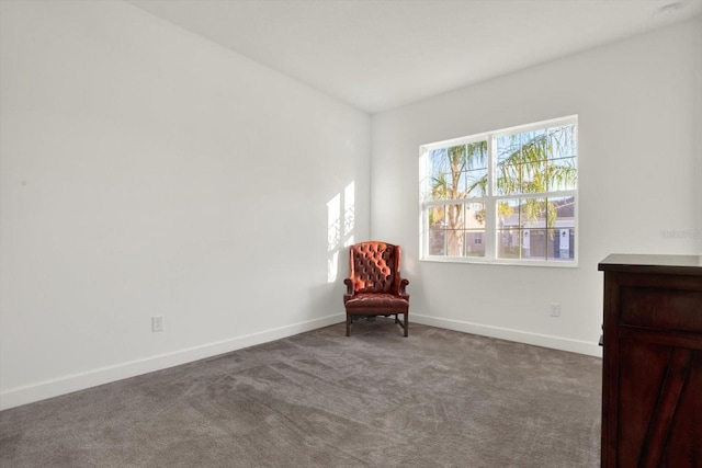 unfurnished room featuring carpet flooring and baseboards