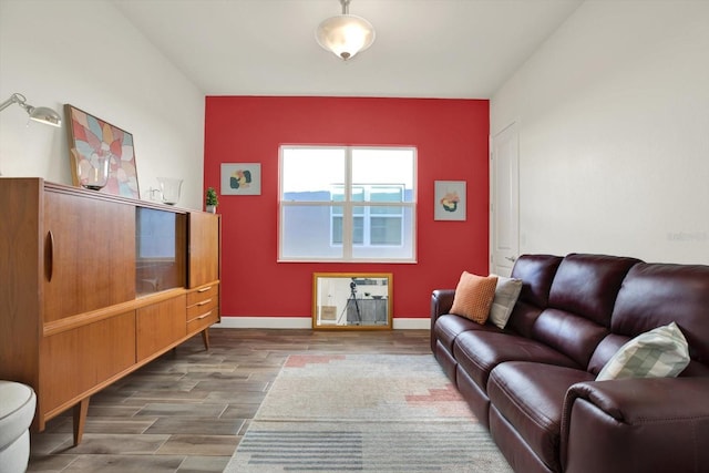 living room with wood finished floors and baseboards