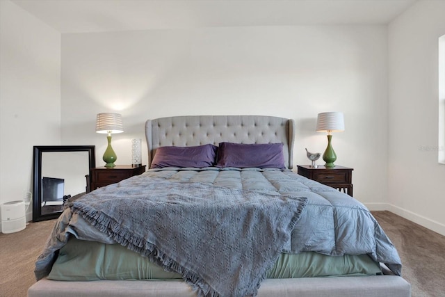 carpeted bedroom with baseboards