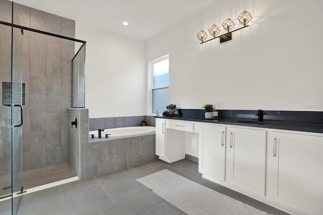 full bath with tile patterned flooring, a garden tub, recessed lighting, a stall shower, and vanity