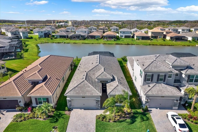 aerial view featuring a residential view and a water view