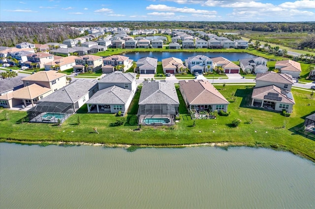 aerial view with a residential view and a water view