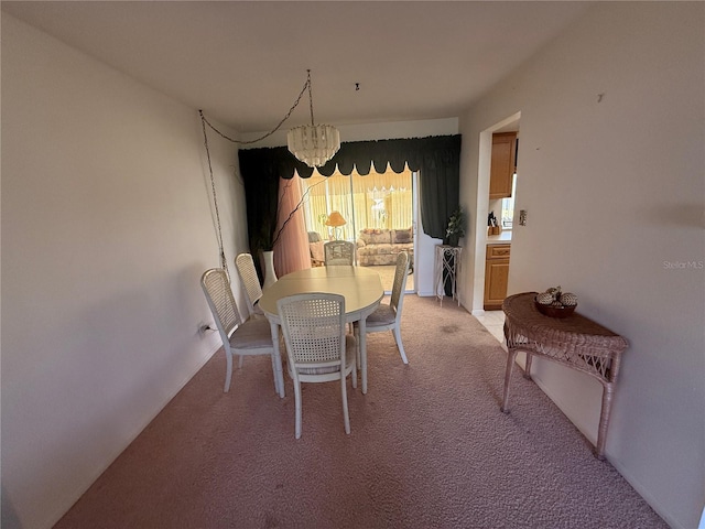 14132 89th Ave, Seminole, FL 33776 - dining area with a chandelier and light carpet