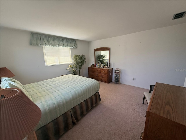 14132 89th Ave, Seminole, FL 33776 - bedroom with visible vents and light carpet