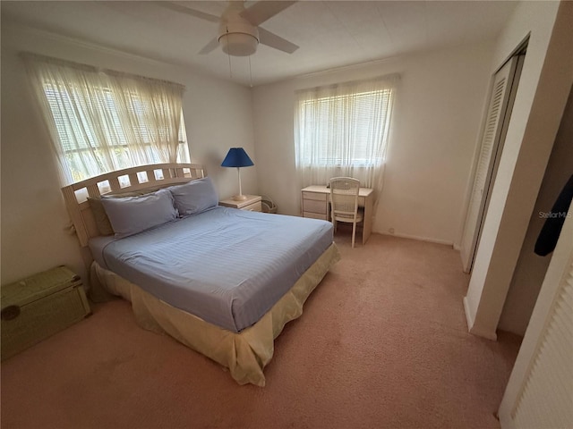 14132 89th Ave, Seminole, FL 33776 - bedroom featuring a ceiling fan, multiple windows, and light carpet