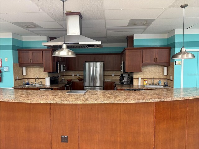 14132 89th Ave, Seminole, FL 33776 - kitchen with range with electric stovetop, a sink, freestanding refrigerator, island exhaust hood, and pendant lighting