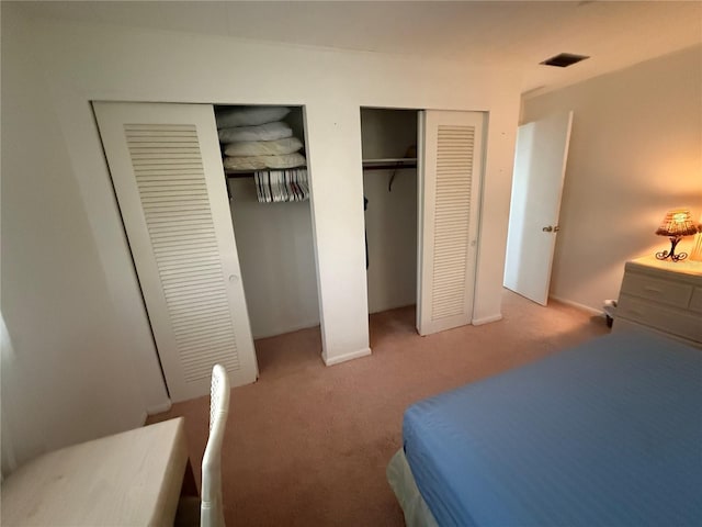 14132 89th Ave, Seminole, FL 33776 - bedroom with multiple closets, visible vents, and carpet floors