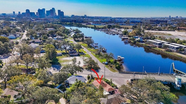 drone / aerial view featuring a view of city and a water view