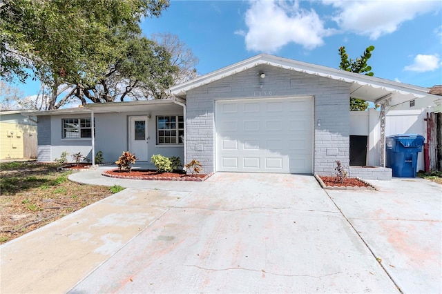 ranch-style home featuring a garage