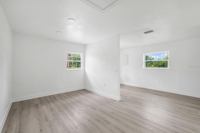 empty room with light hardwood / wood-style floors