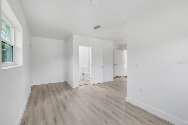 spare room with light wood-type flooring