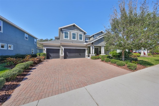 craftsman inspired home with a garage