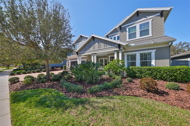 view of front of home featuring a garage and a front yard