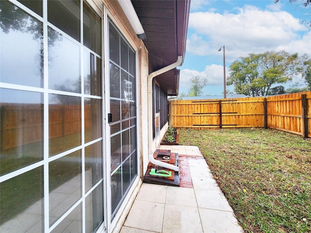 view of yard featuring a patio area and a fenced backyard